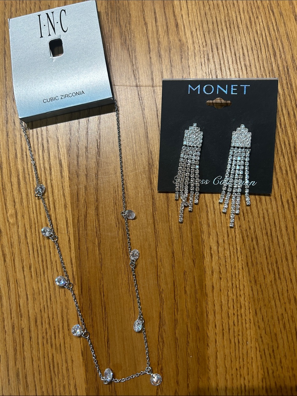 Silver earrings and cubic zirconia necklace